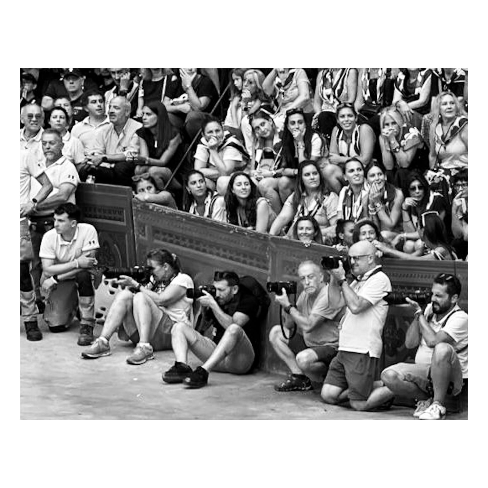 Photographers and crowd on the track in Siena before the Palio