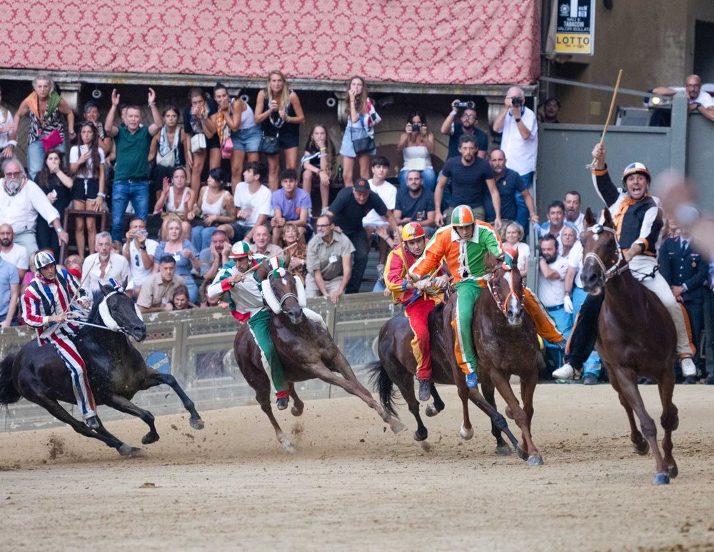 Palio #7 La Lupa vince — Palio di Siena photograph by Vanessa Taylor